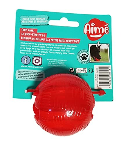 Jouet rouge pour chien Aimé avec étiquette.