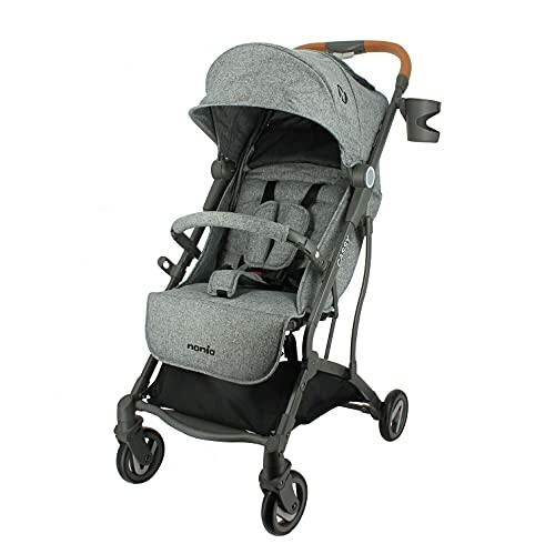 Poussette compacte grise pour bébé avec poignée en cuir et porte-gobelet.