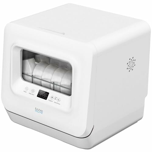 Lave-vaisselle compact sur comptoir blanc.