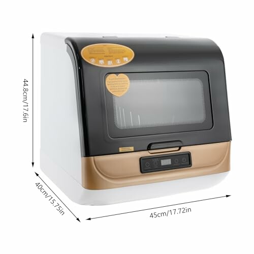 Lave-vaisselle compact sur le comptoir avec mesures indiquées.