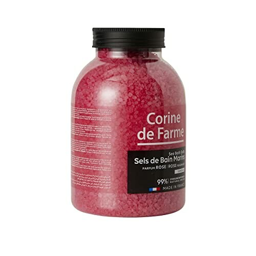 Sels de bain roses dans un pot transparent.