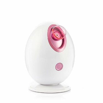 Appareil de vapeur pour le visage blanc et rose.