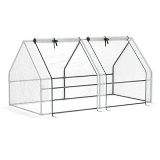 Serre de jardinage avec cadre en métal et couverture transparente