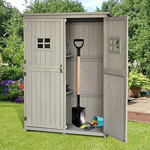 Abri de jardin avec pelle et outils