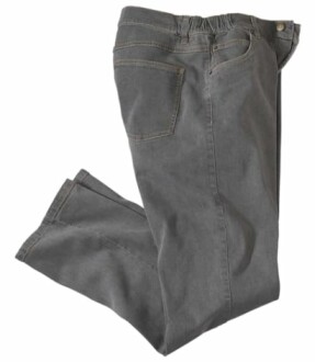 Pantalon en denim gris sur fond blanc.