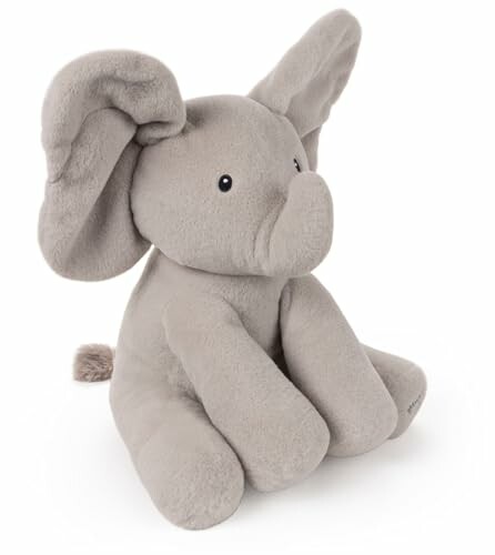 Un éléphant en peluche gris.