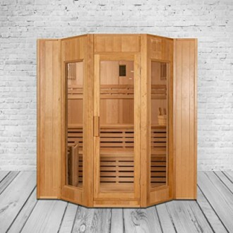 Sauna en bois intérieur contre un mur de briques.