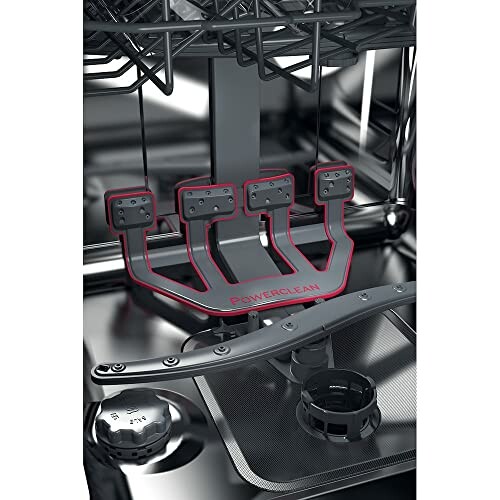Intérieur d'un lave-vaisselle avec bras de lavage.
