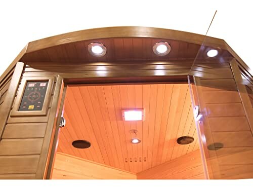 Intérieur d'un sauna infrarouge avec lumières et panneau de contrôle.