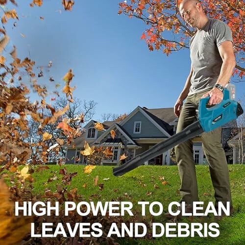 Homme utilisant un souffleur de feuilles devant une maison