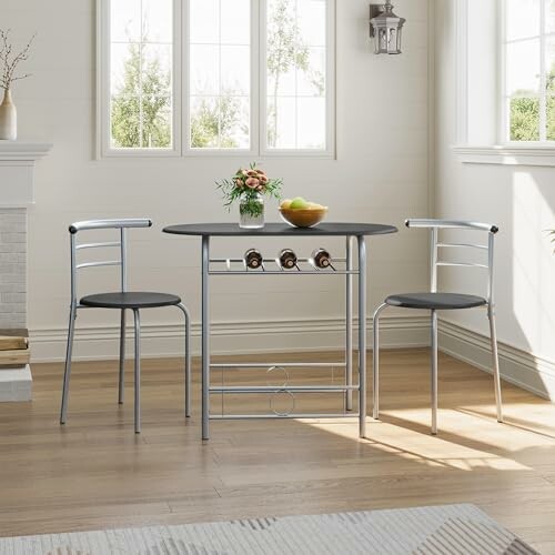 Salle à manger moderne avec table et chaises métalliques.