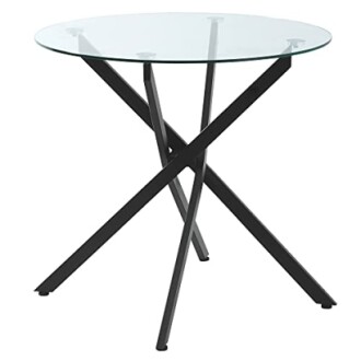 Table moderne avec plateau en verre et pieds en métal noir.