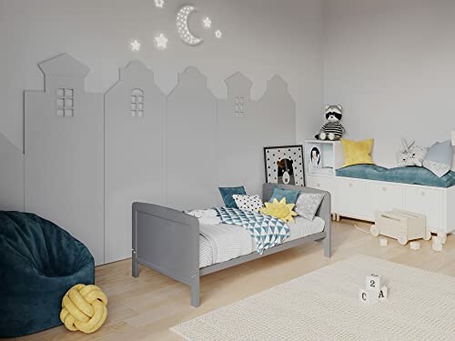 Chambre d'enfant moderne avec lit gris et décorations étoiles