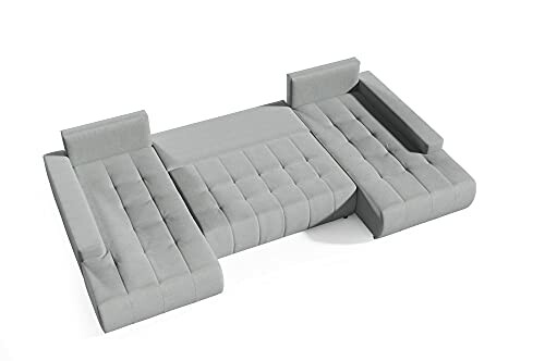 Sofa modulaire gris en trois sections avec repose-tête