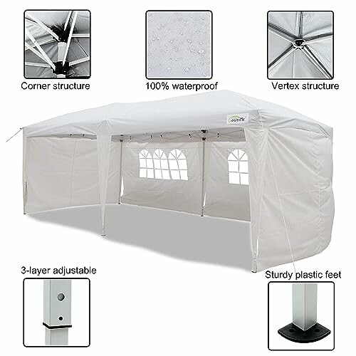 Tente de réception blanche imperméable avec fenêtres et pieds robustes.