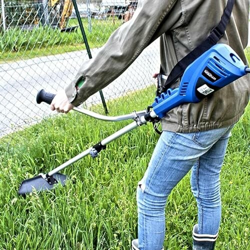 Personne utilisant un taille-bordures dans le jardin.