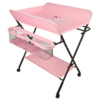 Table à langer rose pour bébé avec étagères