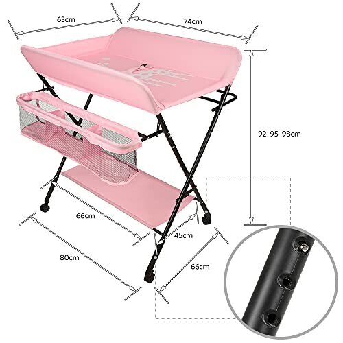 Table à langer rose avec mesures et rangement.