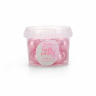 Perles de bain roses dans un pot transparent