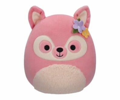 Peluche rose en forme d'animal avec des fleurs sur l'oreille.