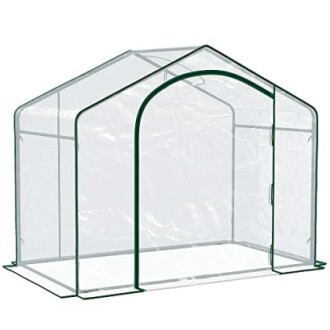 Serre de jardin portable avec couverture transparente.