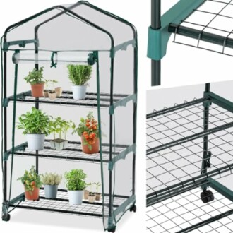 Petite serre portable avec plantes en pot.