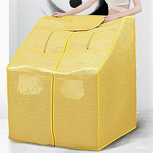 Tente sauna portative jaune avec motifs.