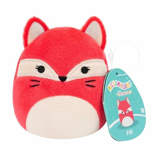 Peluche en forme de renard rouge avec étiquette.
