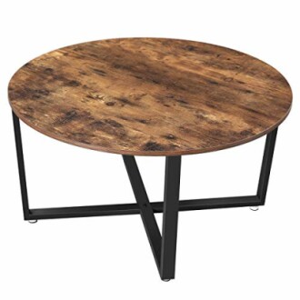 Table basse ronde en bois avec pieds métalliques noirs.