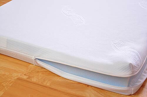 Matelas blanc avec fermeture éclair sur le côté