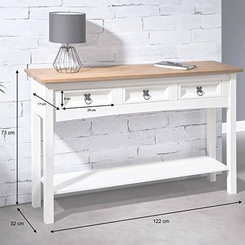 Table console blanche en bois avec lampe grise.