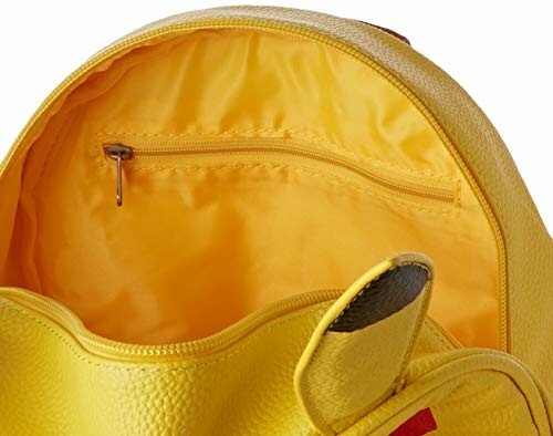 Intérieur d'un sac à dos jaune avec une poche zippée.